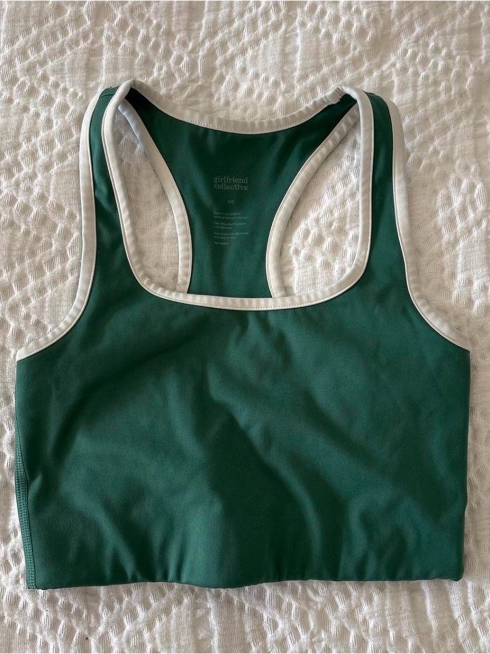 girlfriend collective deep green sports bra with white trim